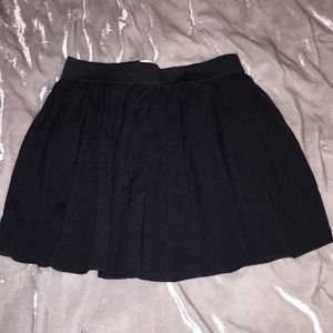 Black pleaded skirt.